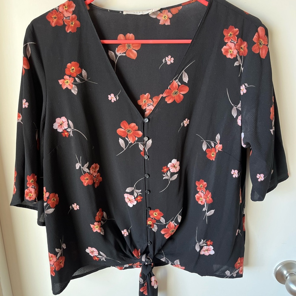 Lush Black Blouse with Red Floral Design